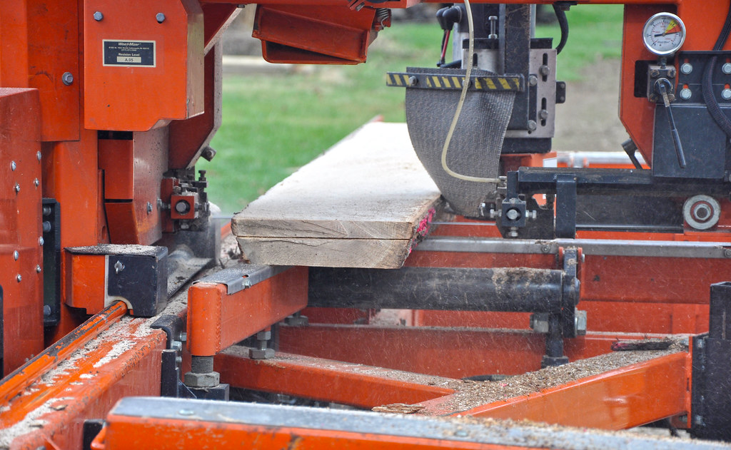 Band saw cutting a board at the sawmill